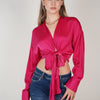 Blusa glamurosa con cuello en V y nudo