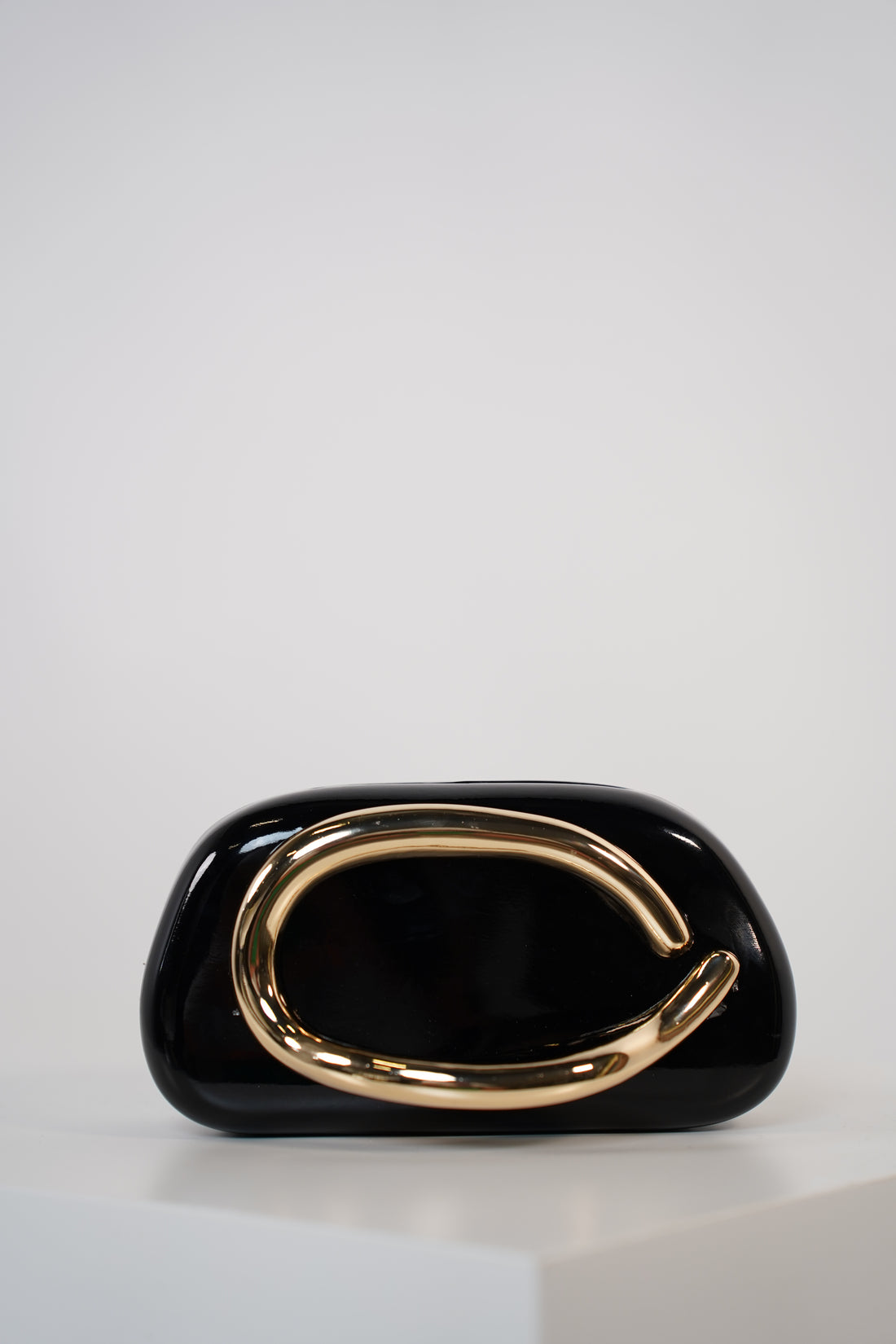 Bellora Shiny Clutch – Sculpted Gloss Statement Bag