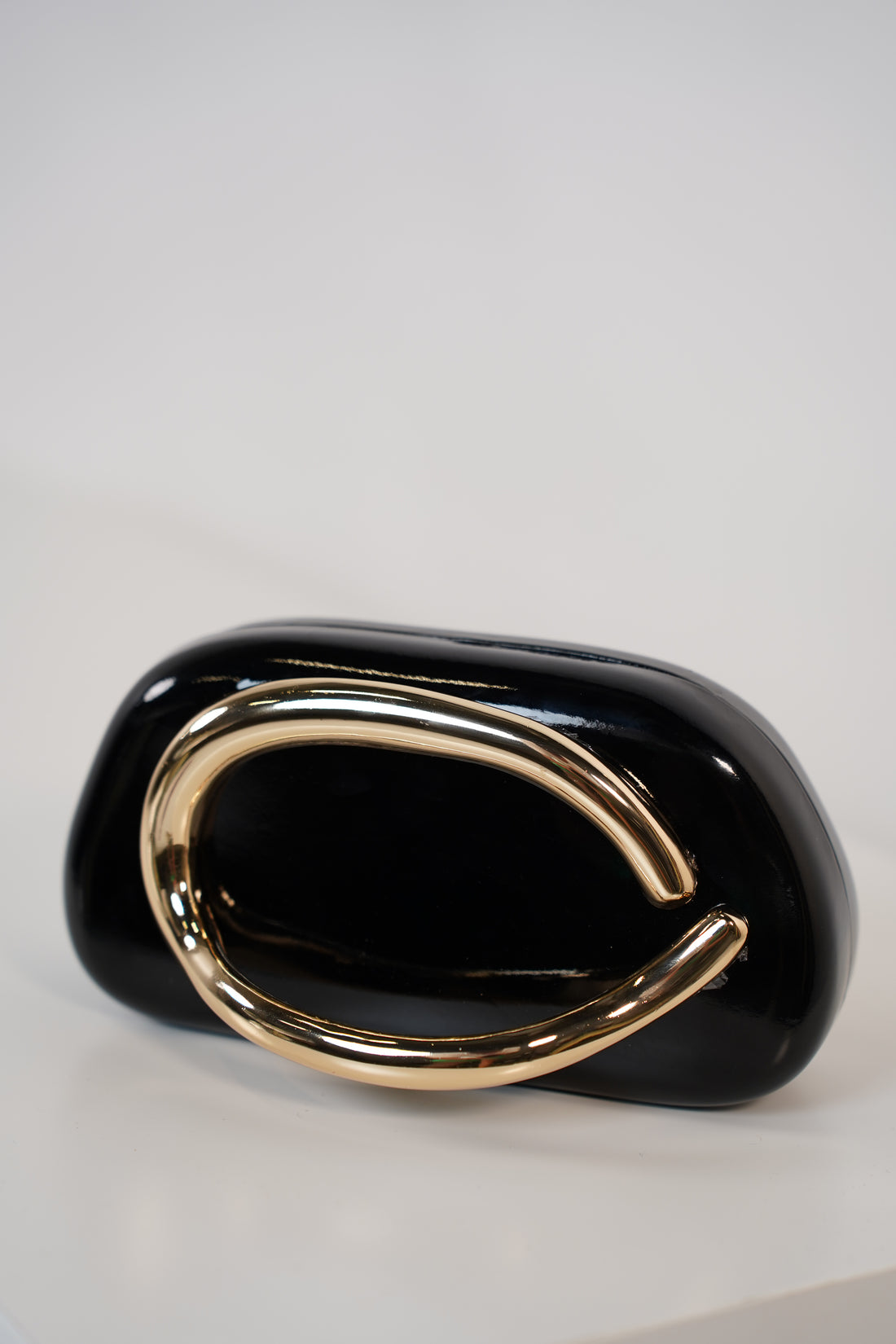 Bellora Shiny Clutch – Sculpted Gloss Statement Bag