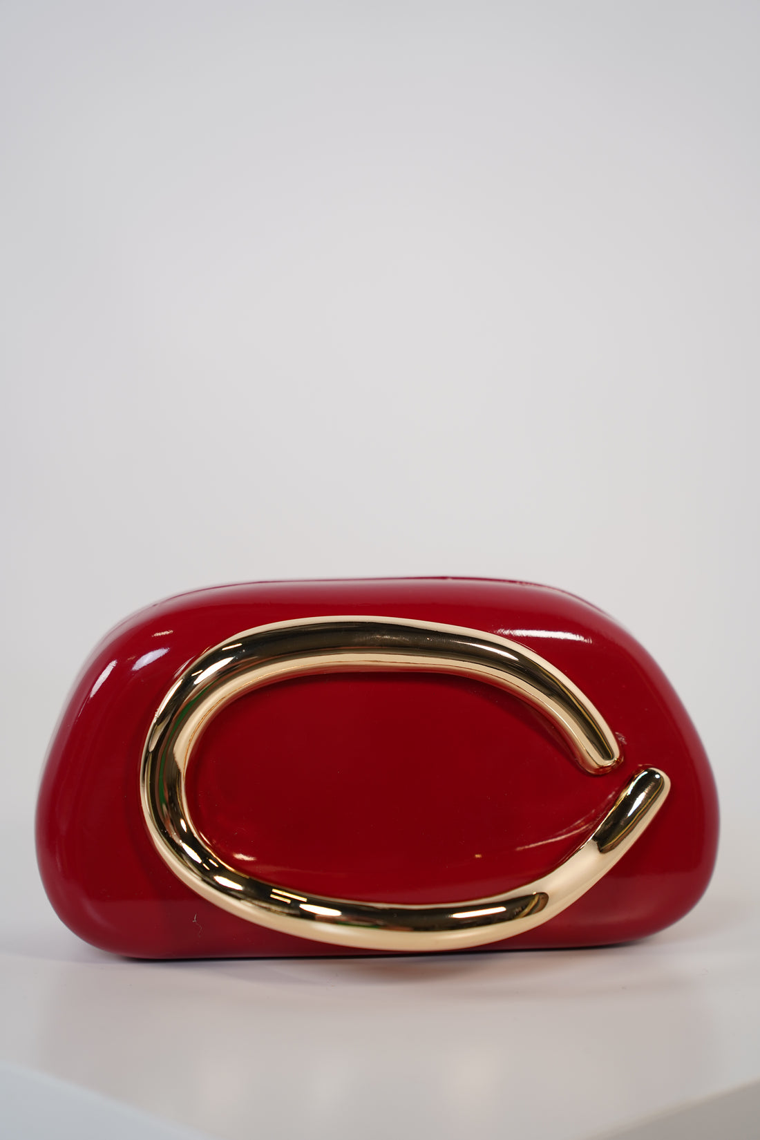 Bellora Shiny Clutch – Sculpted Gloss Statement Bag