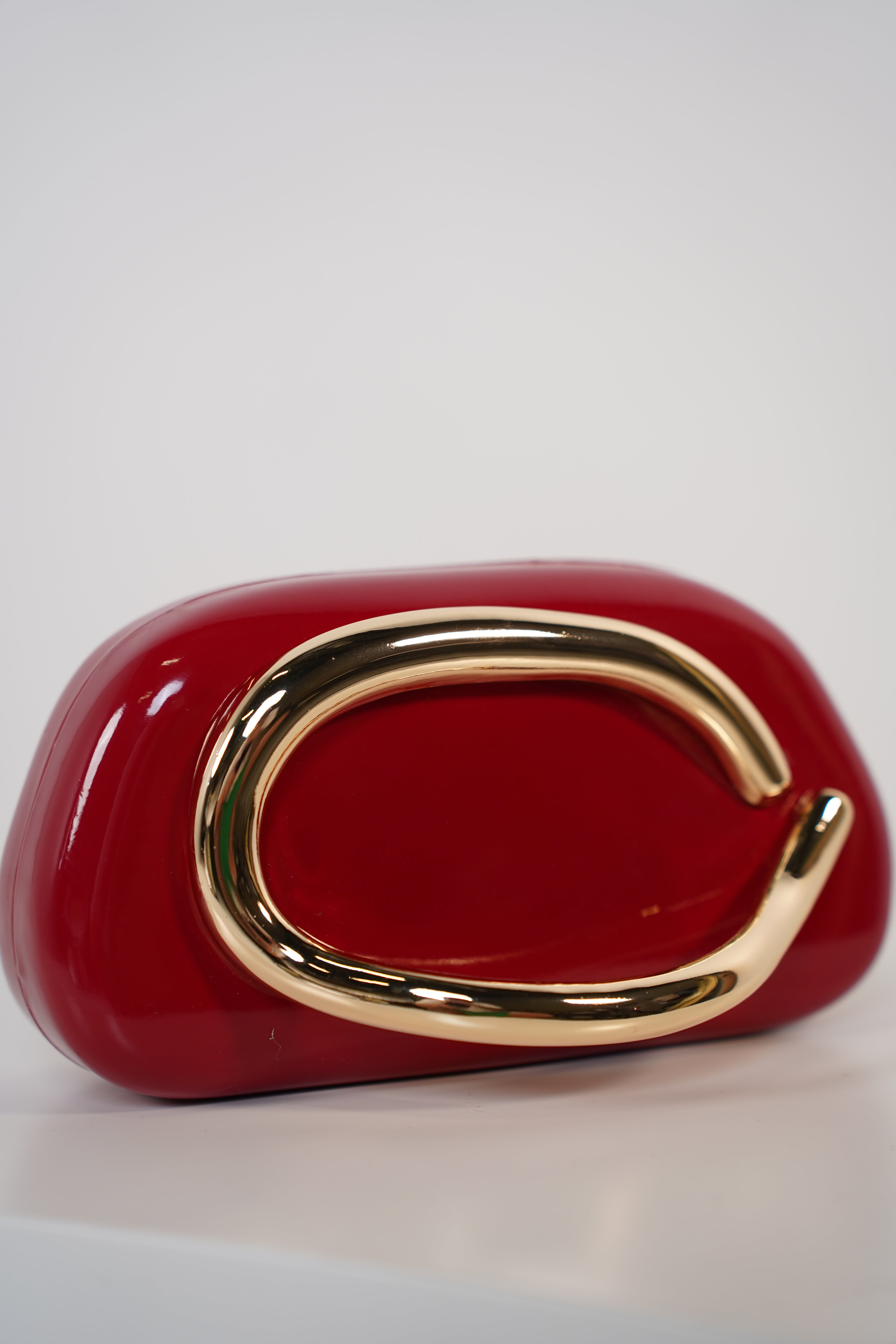 Bellora Shiny Clutch – Sculpted Gloss Statement Bag