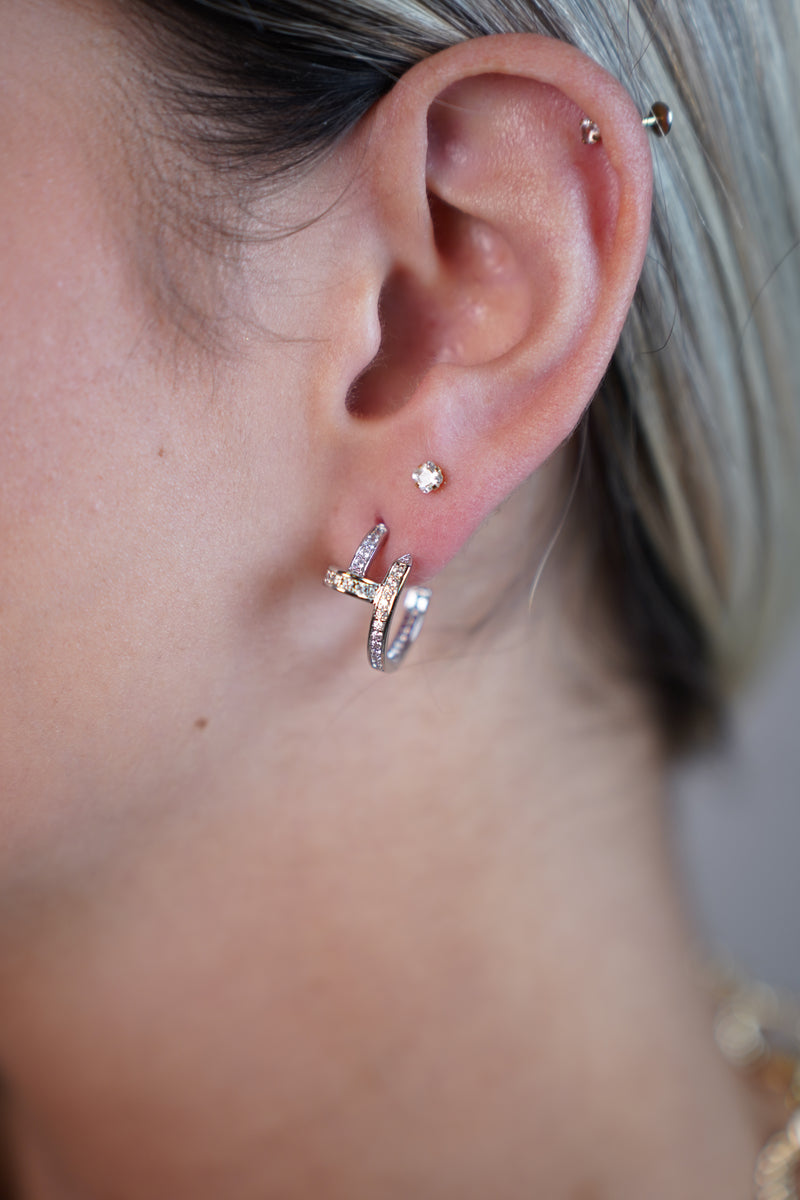 Cleef Twist Sparkle Huggie Earrings – Modern Curved Hoops with Crystals