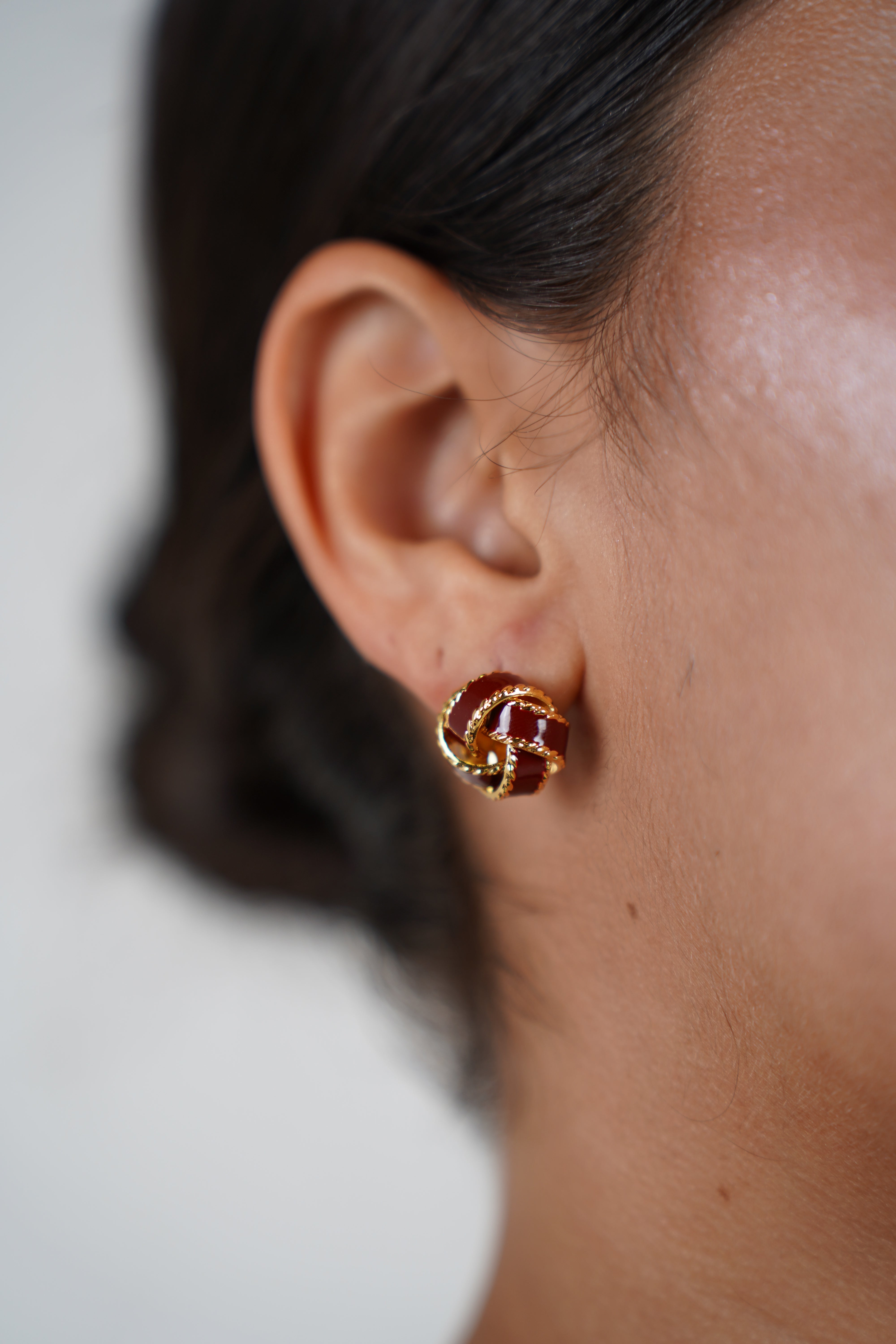 Yezel Knot Studs – Classic Twist with a Touch of Red