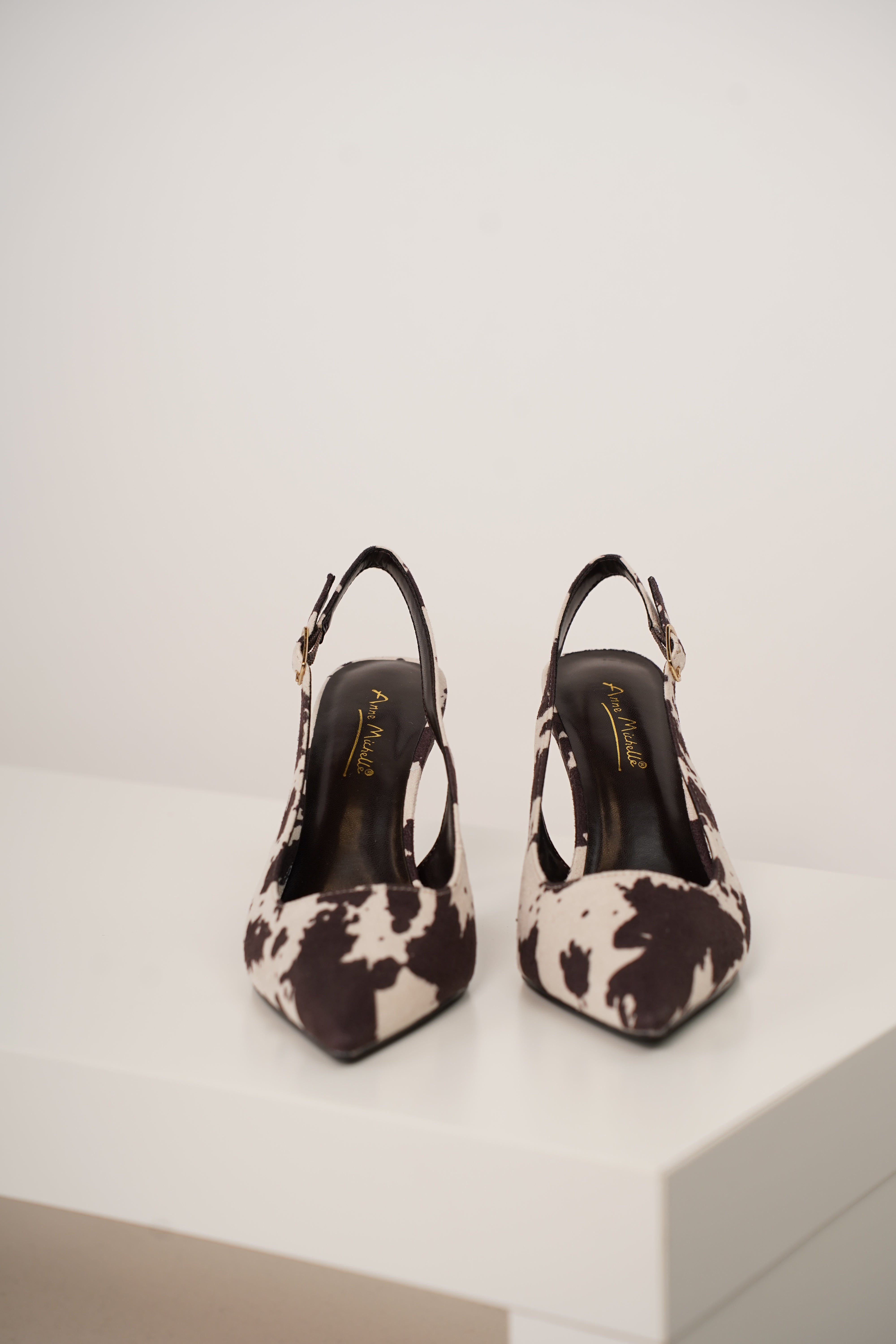 Unity Cow Print Pumps – Edgy Chic with a Western Twist