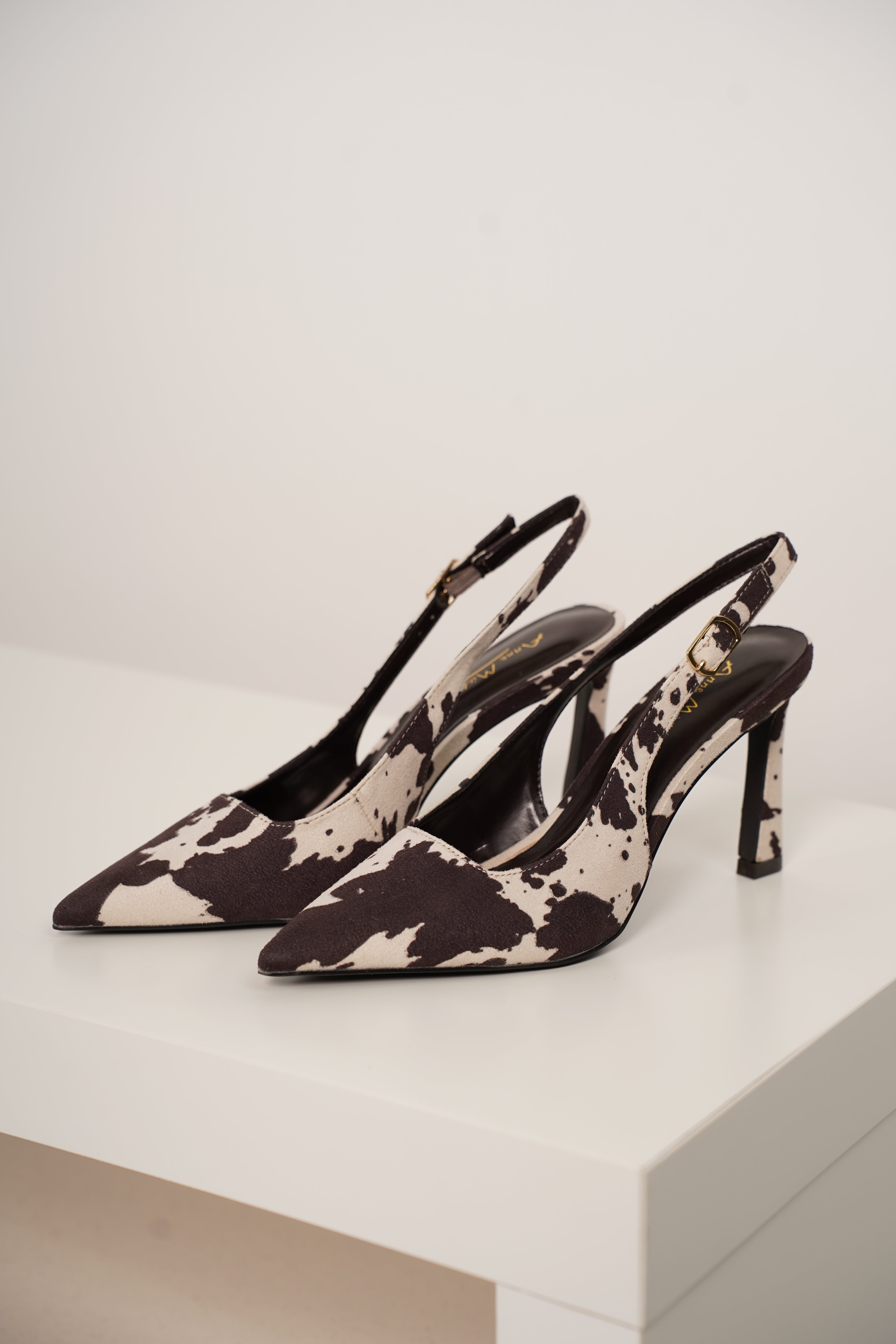 Unity Cow Print Pumps – Edgy Chic with a Western Twist