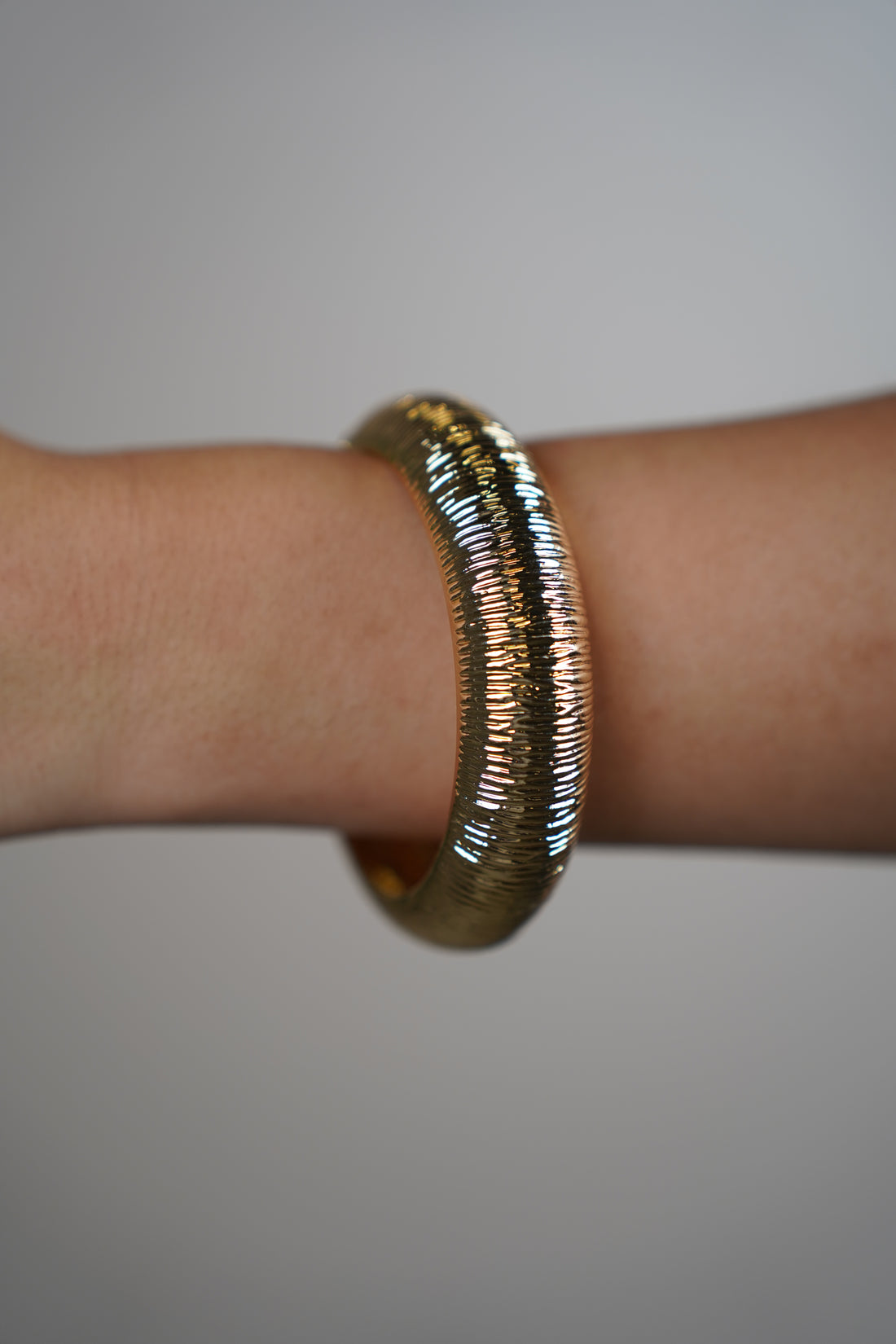 Sora Lined Textured Bracelet – Sleek Gold Shine with Modern Detail