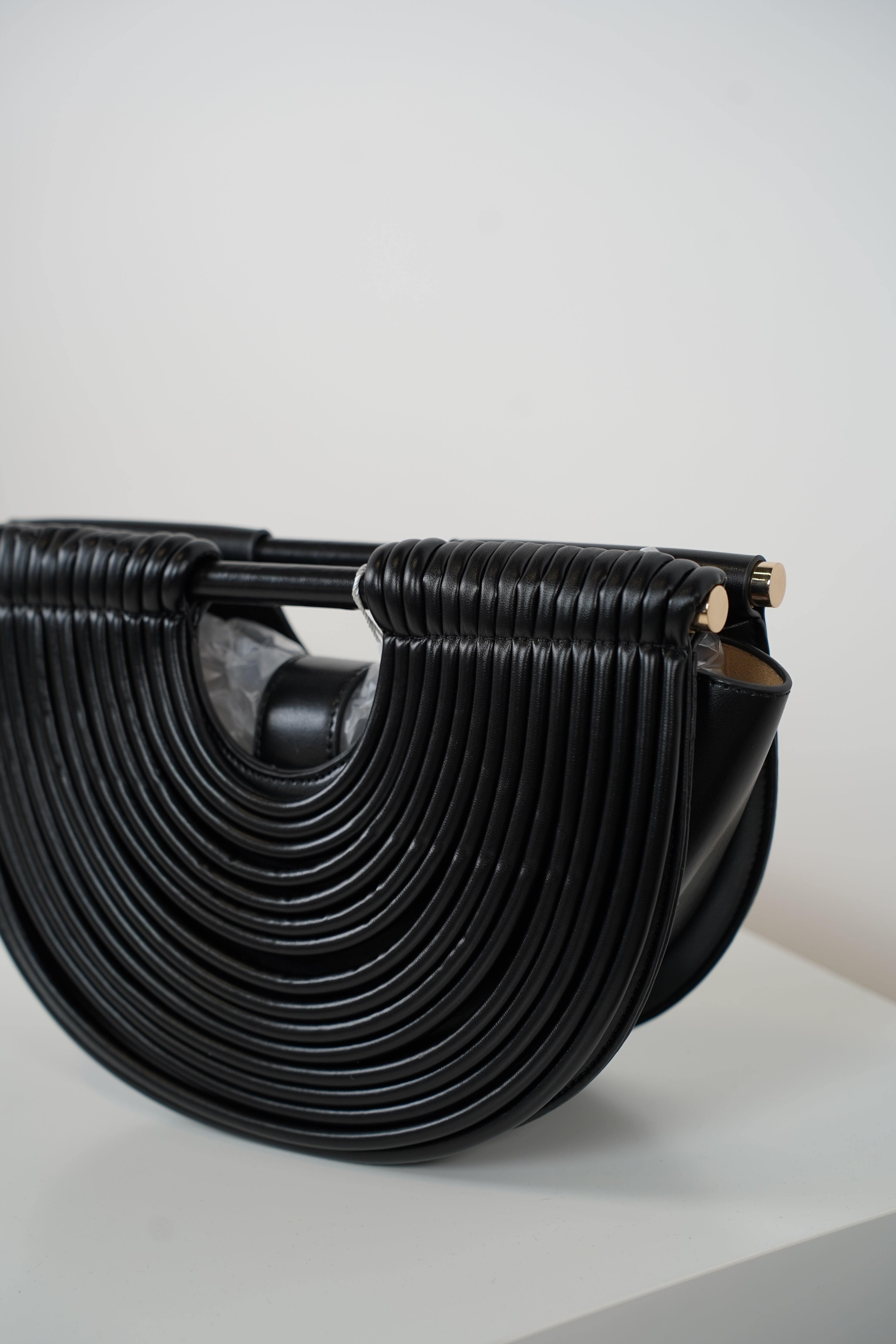 Osiris Clutch – Sculptural Half-Moon Bag