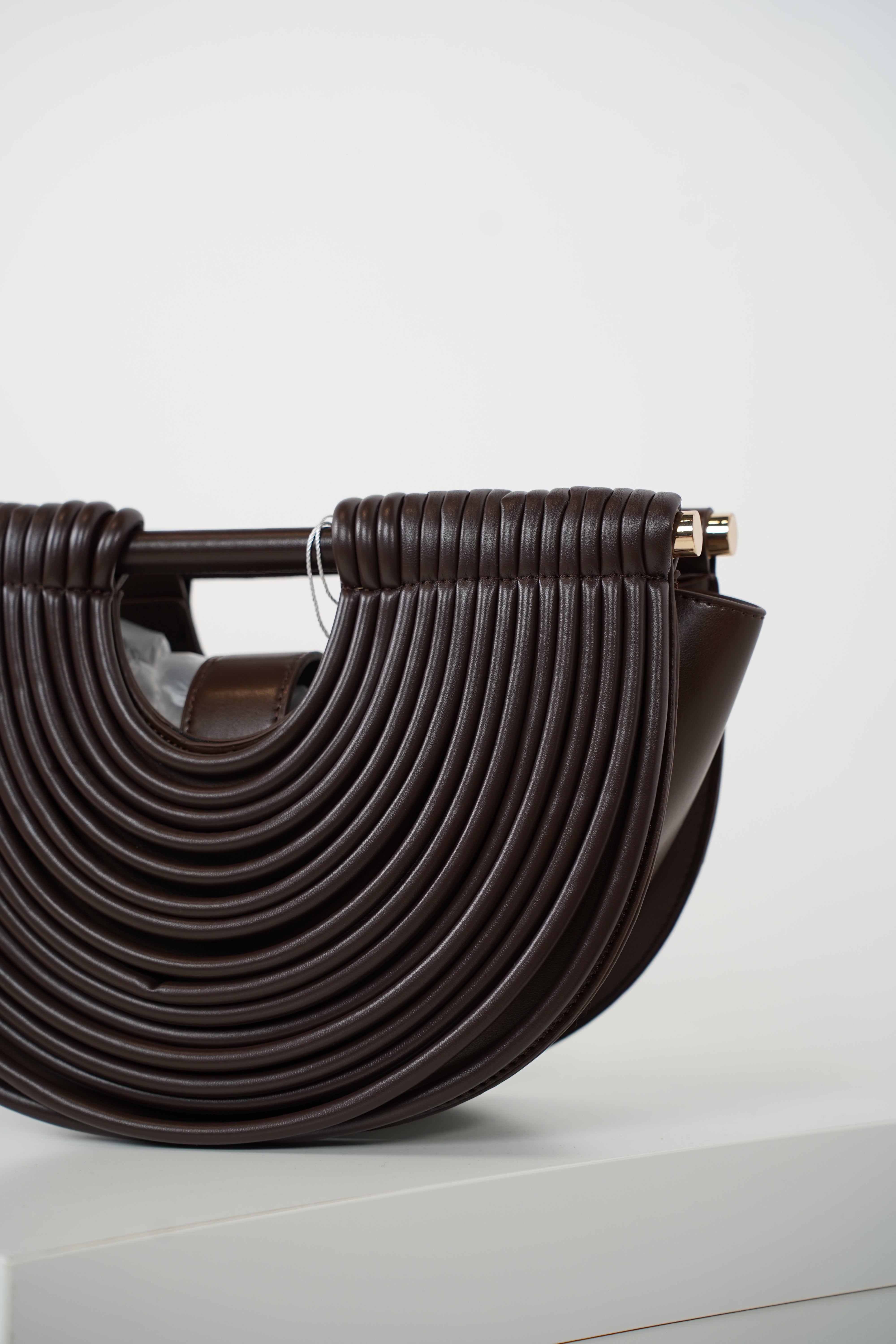 Osiris Clutch – Sculptural Half-Moon Bag