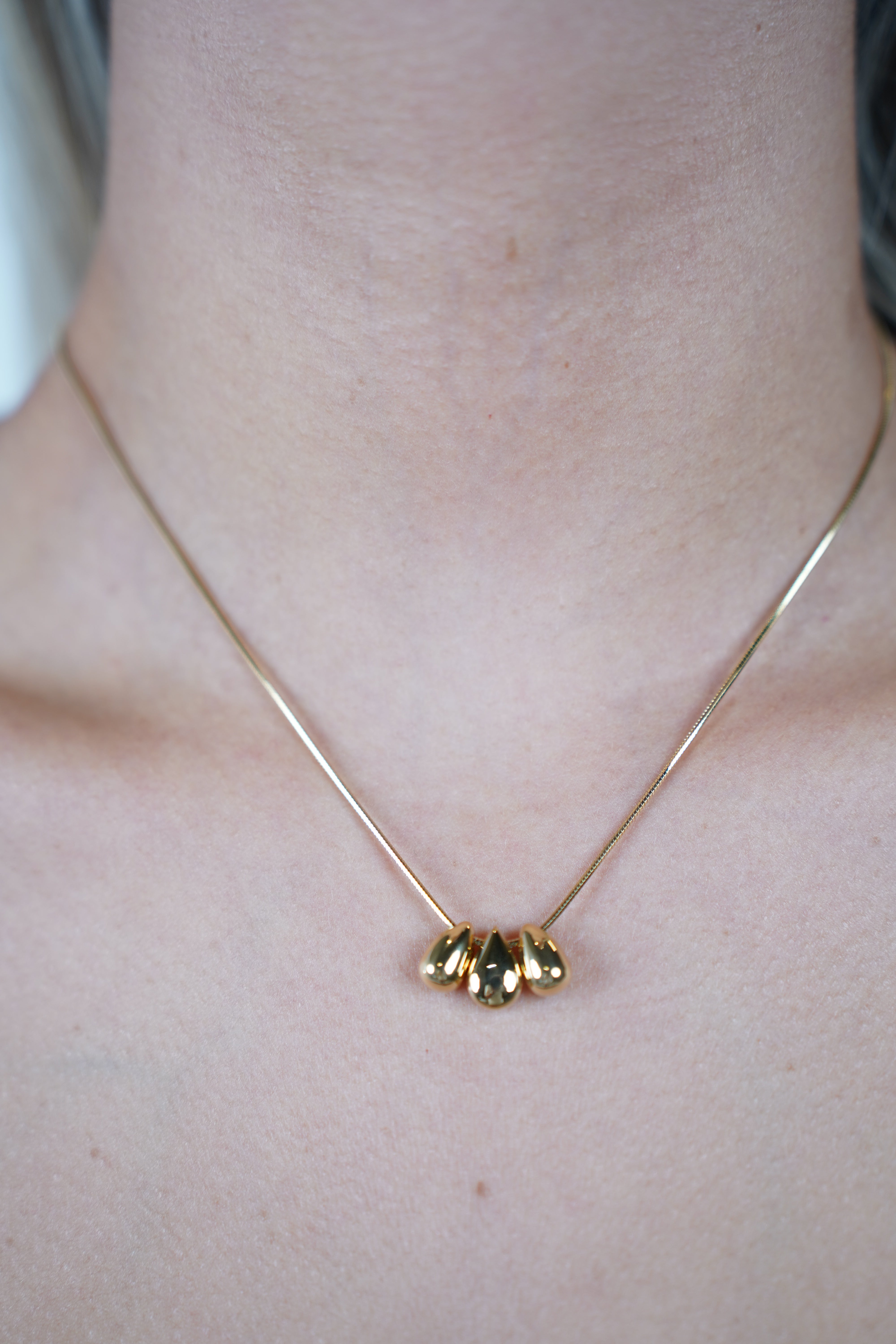 Lani Tear Necklace – Gold Snake Chain with Metallic Drop Pendants