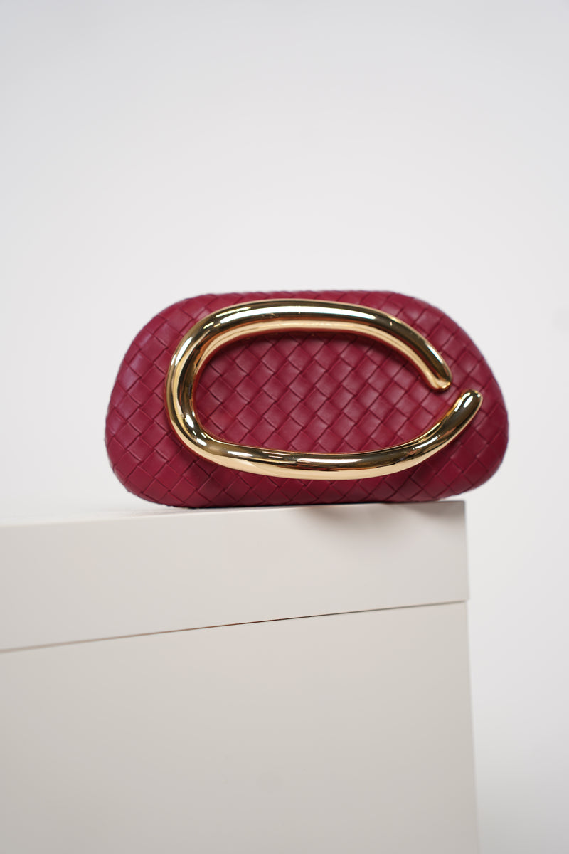 Viola Clutch – Woven Plum Statement Bag with Sculptural Gold Handle