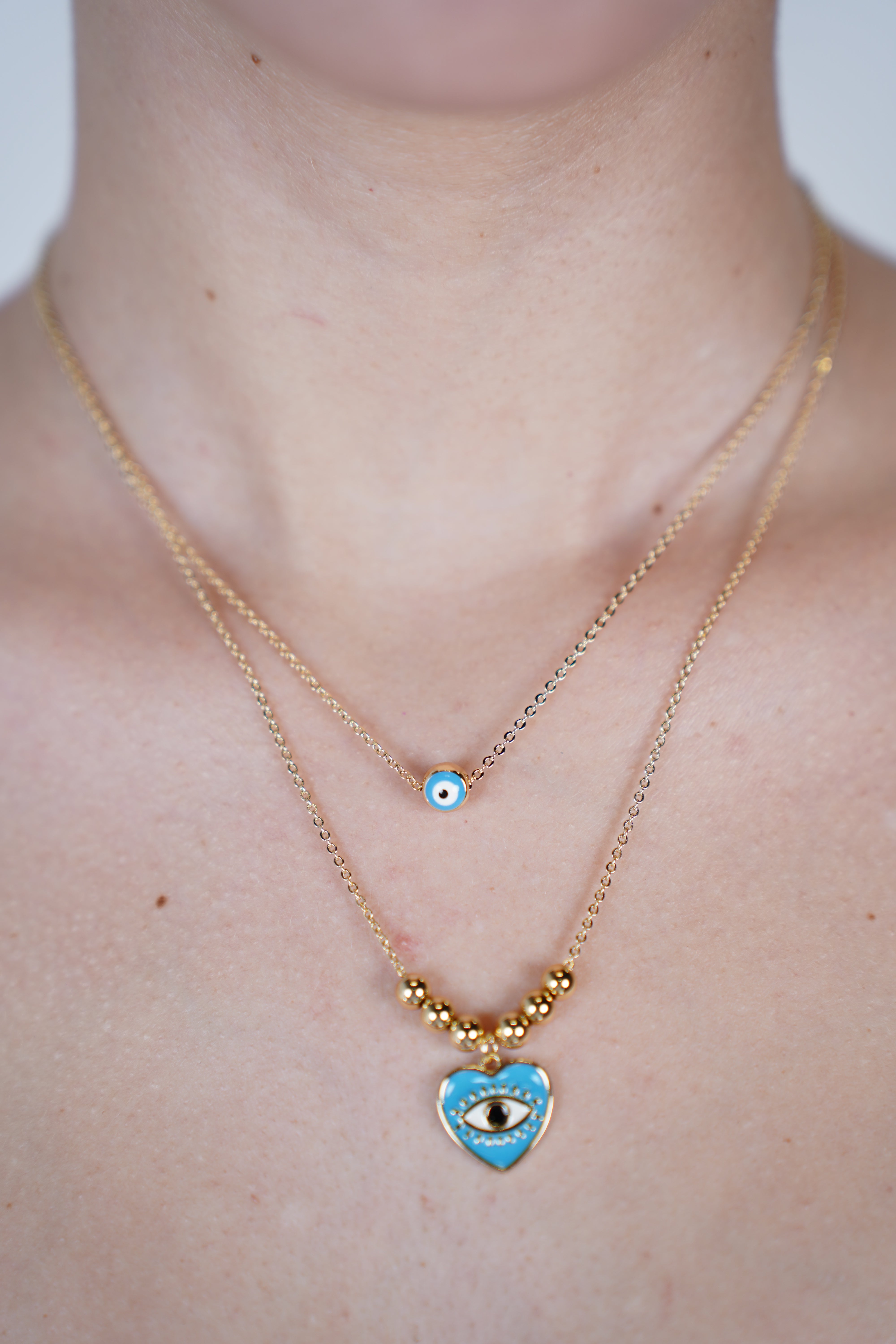 Zeni Evil Eye Necklace – Double Chain Protection with a Pop of Blue